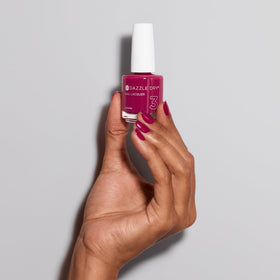 Dazzle Dry lacquer being applied to a natural nail for quick-dry finish