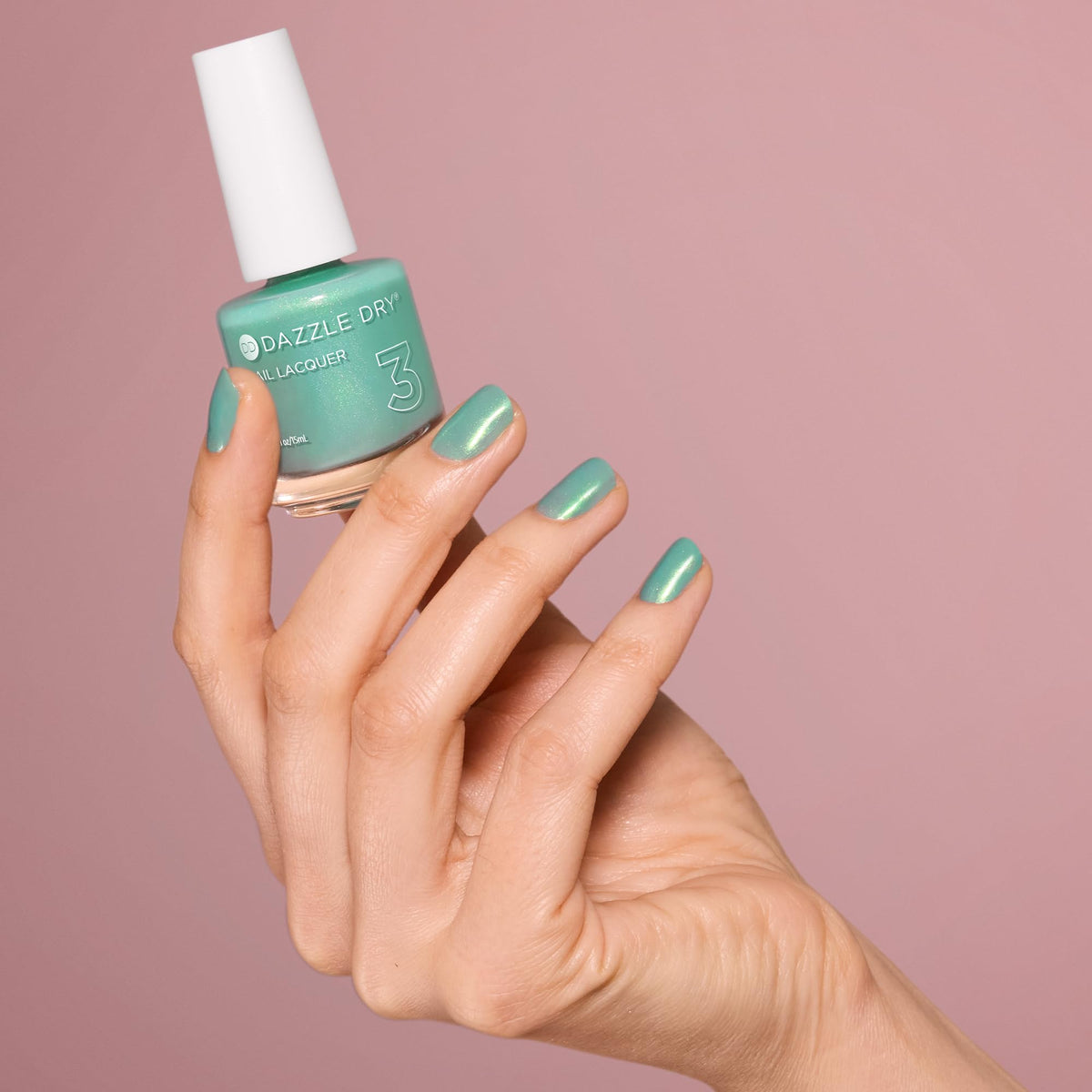 Dazzle Dry swatches on nail tips illustrating buildable seafoam coverage