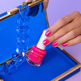 Dazzle Dry swatch on nail wheel showing layered opacity benefit
