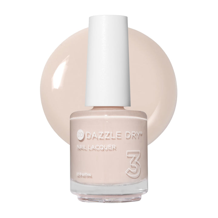 Dazzle Dry bottle front view showing pale almond color and compact size
