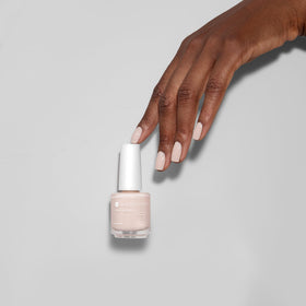 Nail tip swirl of So On Pointe showing semi-sheer cream buildability