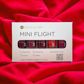 Dazzle Dry swatches on wrist displaying each red shade and color selection benefit