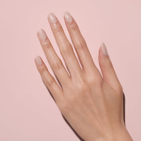 Hand applying Dazzle Dry Wish illustrating fast-drying convenience benefit