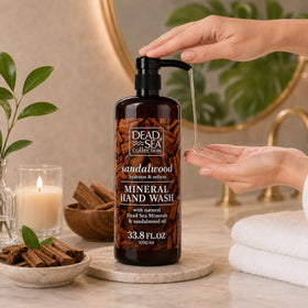 Dead Sea Collection two bottles next to hand for size comparison and value benefit