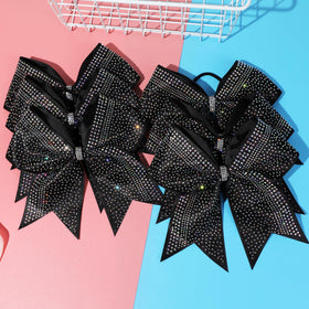 DEEKA hand holding bow to show 8 inch size and visible scale
