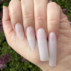 Close-up of carved nail detail using DeEnti powder illustrating precise sculpting and definition