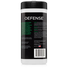 Label close-up showing Defense Soap ingredients tea tree, peppermint, and eucalyptus