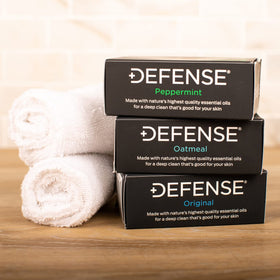 Defense Soap Original bar label close-up highlighting tea tree and eucalyptus cleansing benefit