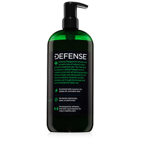 Defense Soap 32 oz bottle held in hand showing generous size