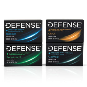 Defense Soap variety pack front packaging showing four full-size bars and benefits