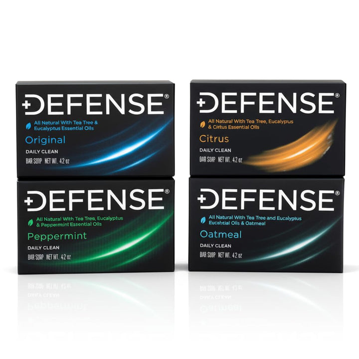 Defense Soap variety pack front packaging showing four full-size bars and benefits