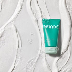 DEINDE bathroom lifestyle use showing calm skincare routine and barrier care