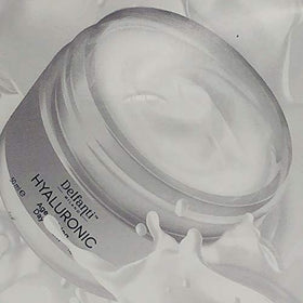 applying Delfanti-Milano to neck demonstrating firming and moisturizing benefit