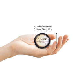 DEMÚRE brush applying smoky blue powder illustrating easy pickup and even application