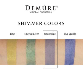 DEMÚRE swatch on skin demonstrating smoky blue pigmentation and buildable color payoff