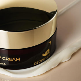 Deoproce cream on hand demonstrating lightweight spread and hydration