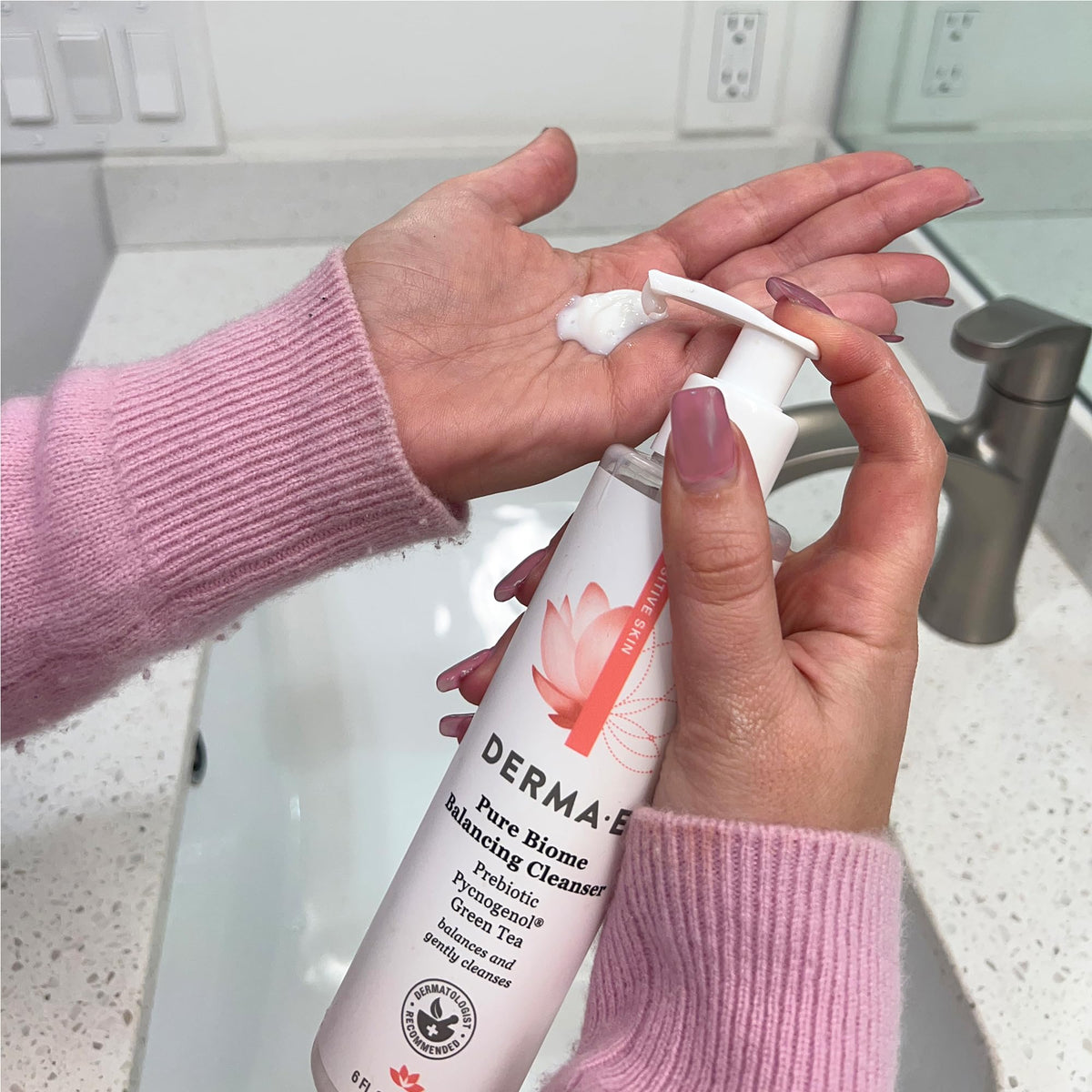 Derma E beside sink in bathroom lifestyle setting conveying calming daily ritual