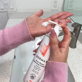 Derma E beside sink in bathroom lifestyle setting conveying calming daily ritual