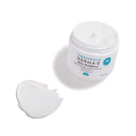 Derma E cream on elbow demonstrating body brightening benefit