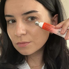 Derma E product beside ruler showing 0.5 fl oz compact travel-friendly size