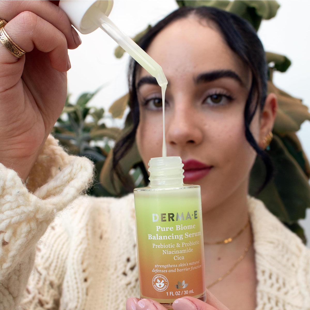 Derma E applying serum on hand to show lightweight finish and quick hydration