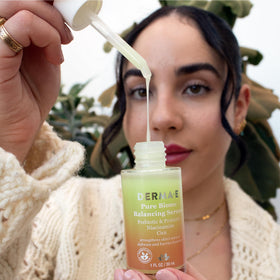 Derma E applying serum on hand to show lightweight finish and quick hydration