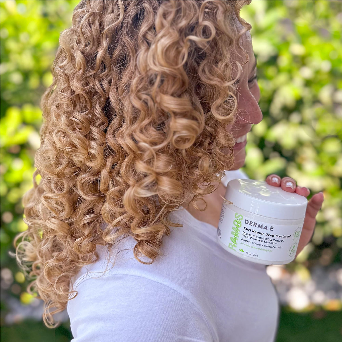 Derma E jar held in hand showing 10 oz scale and travel-friendly convenience