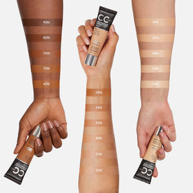 Dermablend CC Cream being applied with a makeup brush for even, buildable full coverage