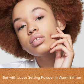 Dermablend brush applying powder demonstrating even lightweight finish