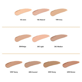 Dermablend concealer stick held in hand showing size and travel convenience