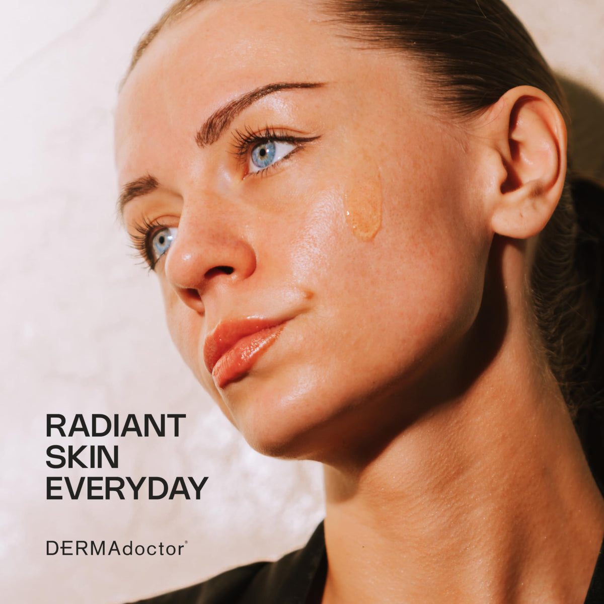 DERMAdoctor application removing mascara and sunscreen demonstrating effective makeup removal benefit