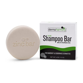 Dermaharmony shampoo bar in hand for scale showing long‑lasting concentrated size
