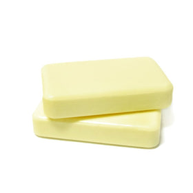 DermaHarmony bar in hand lathering to cleanse and control oil