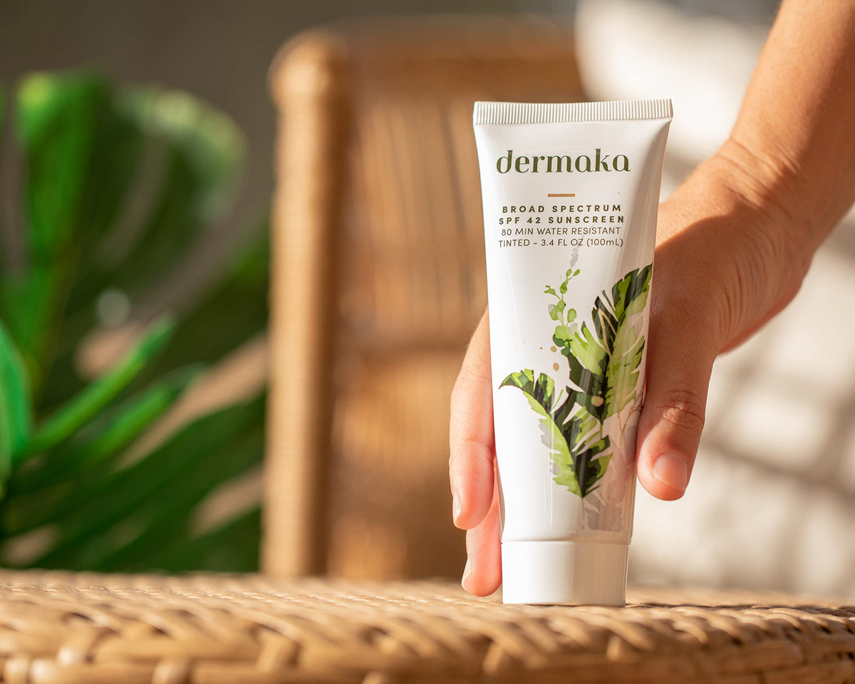 Dermaka tube beside a ruler showing 3.4 oz size for travel and daily use