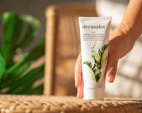Dermaka tube beside a ruler showing 3.4 oz size for travel and daily use
