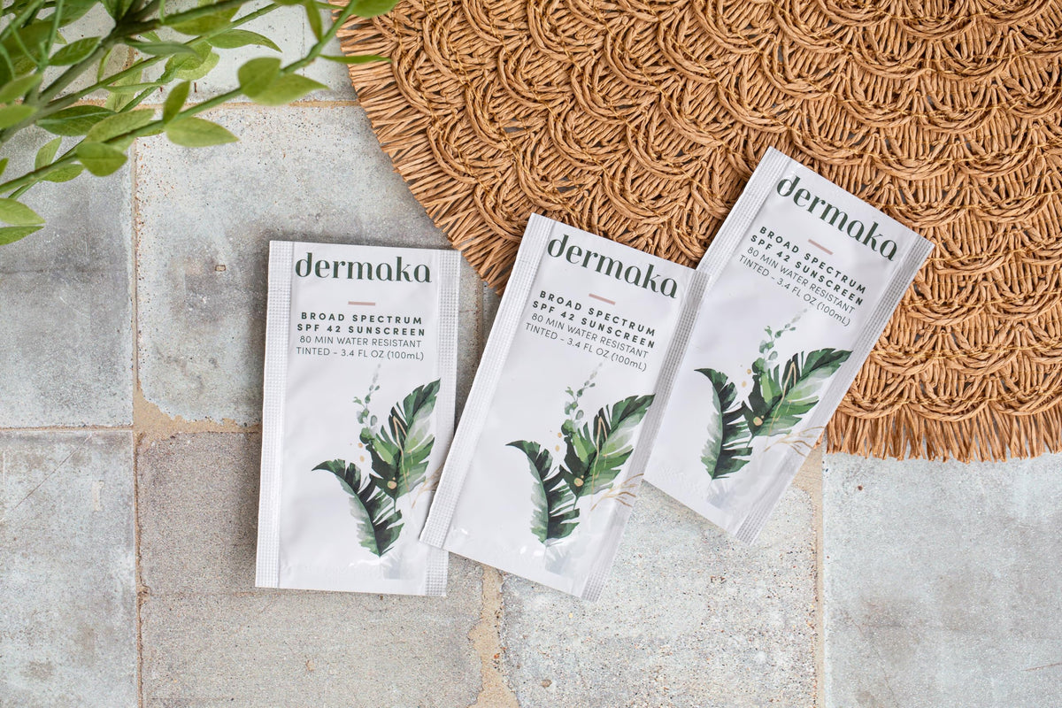 Dermaka sachet in beach bag showing on-the-go sun protection benefit