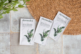 Dermaka sachet in beach bag showing on-the-go sun protection benefit