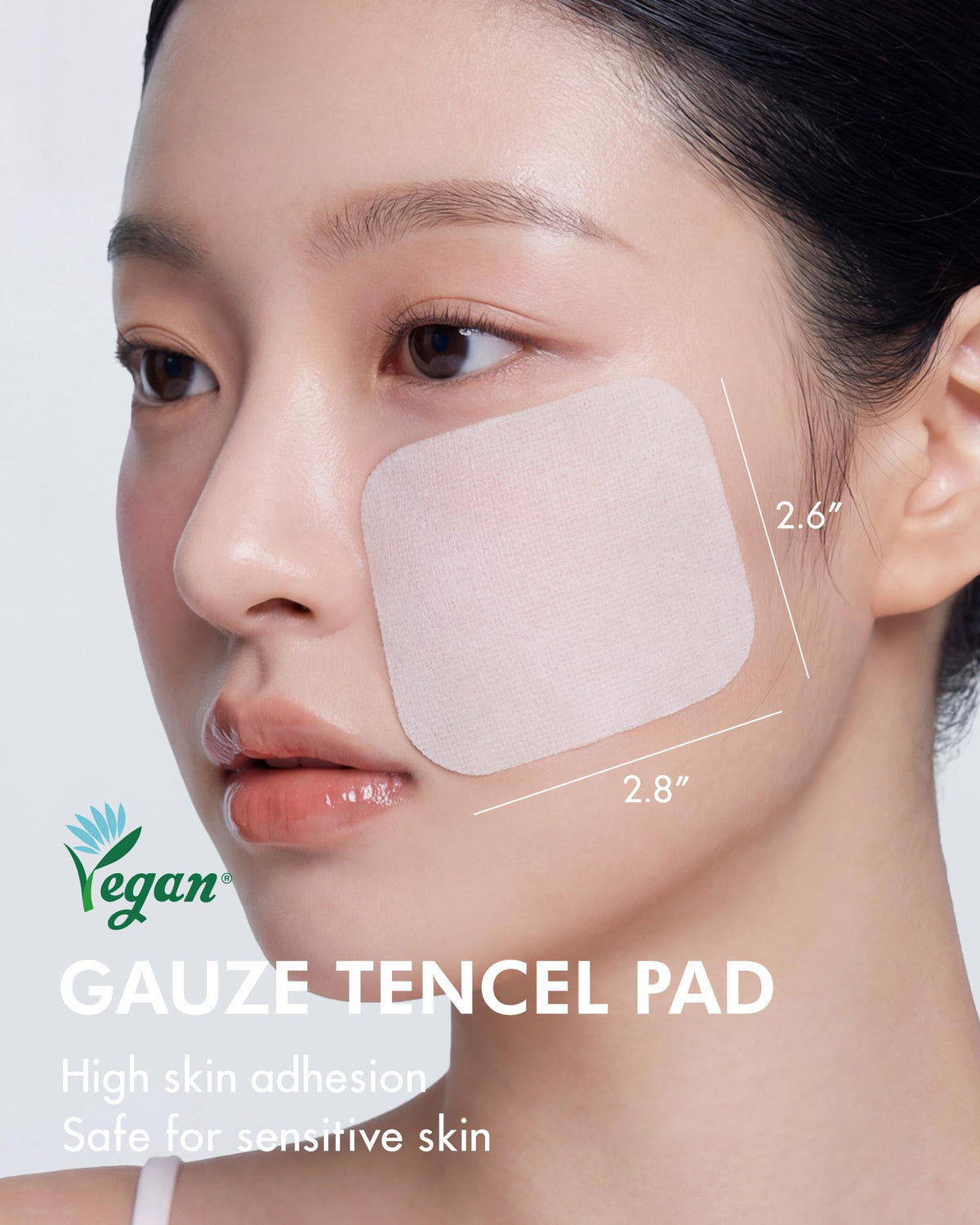DERMAL pad placed on cheek demonstrating targeted spot pack for soothing care