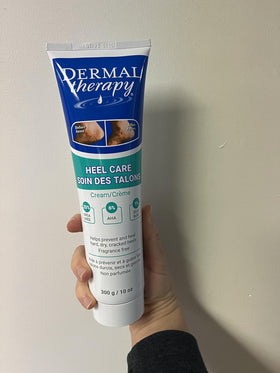 Dermal Therapy 300g jar next to a hand for size comparison and usage estimation