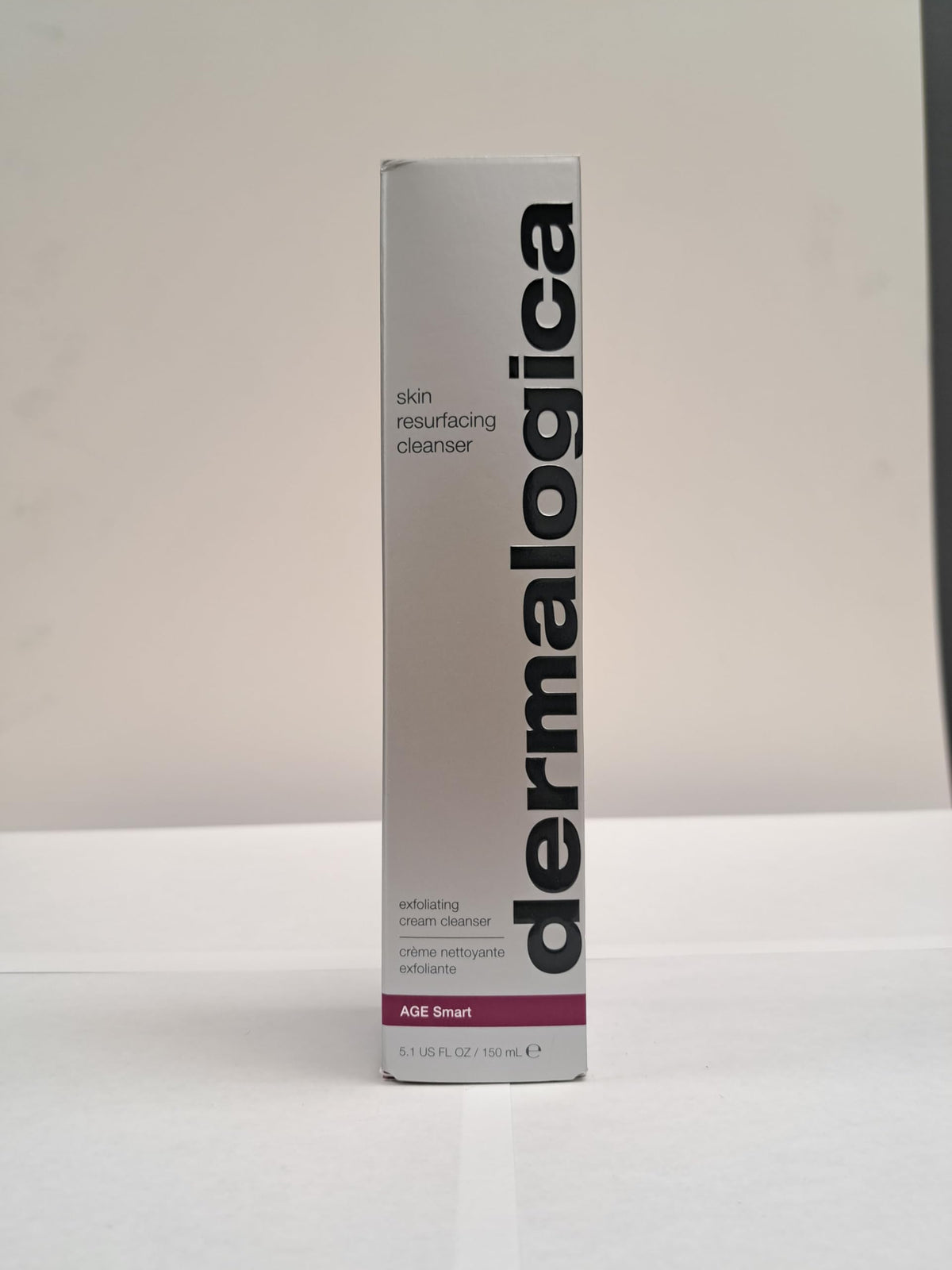 Dermalogica bottle with ingredients list emphasizing active lactic acid benefit