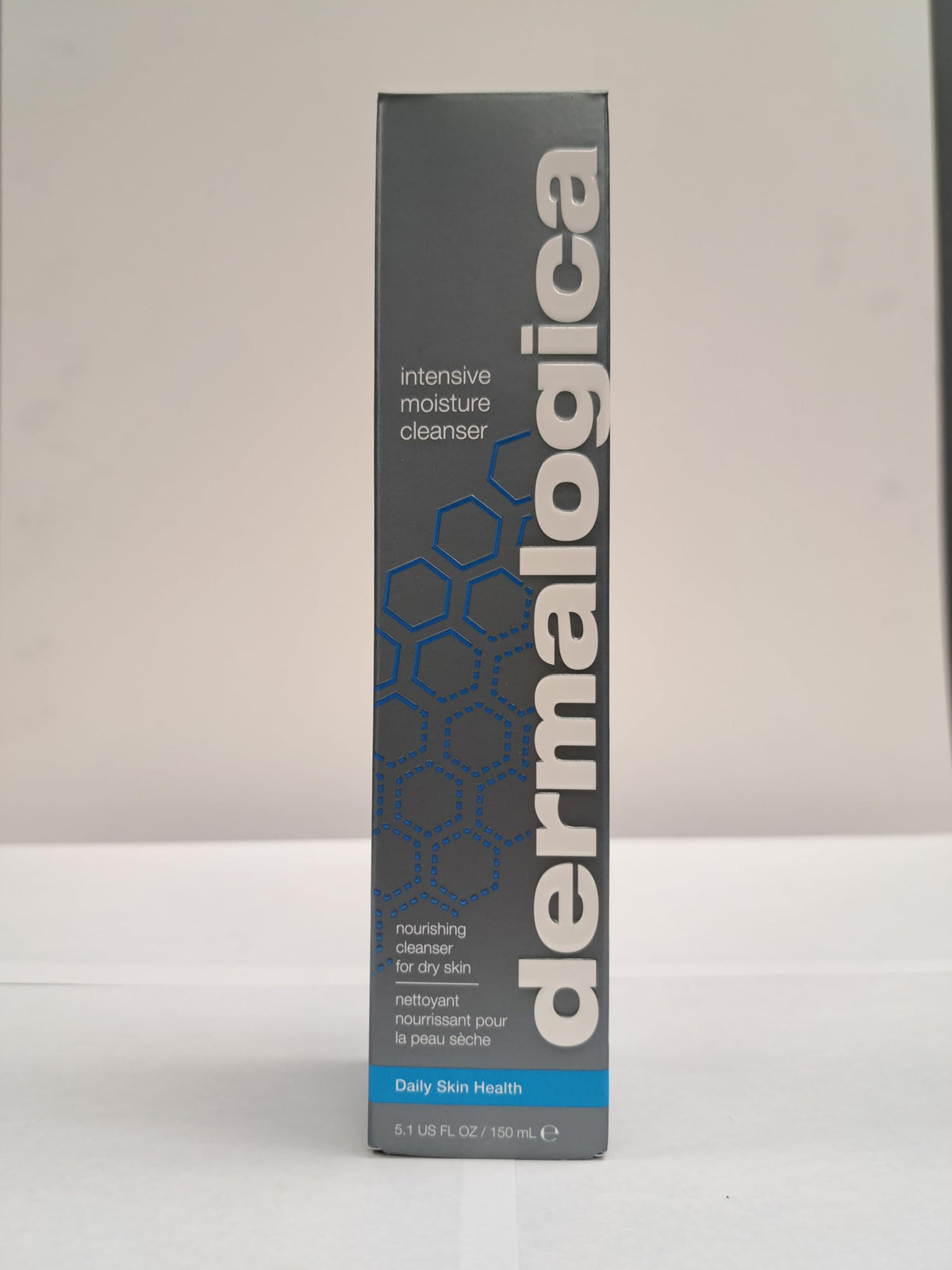 Dermalogica cleanser next to hand showing 5.1 fl oz size benefit