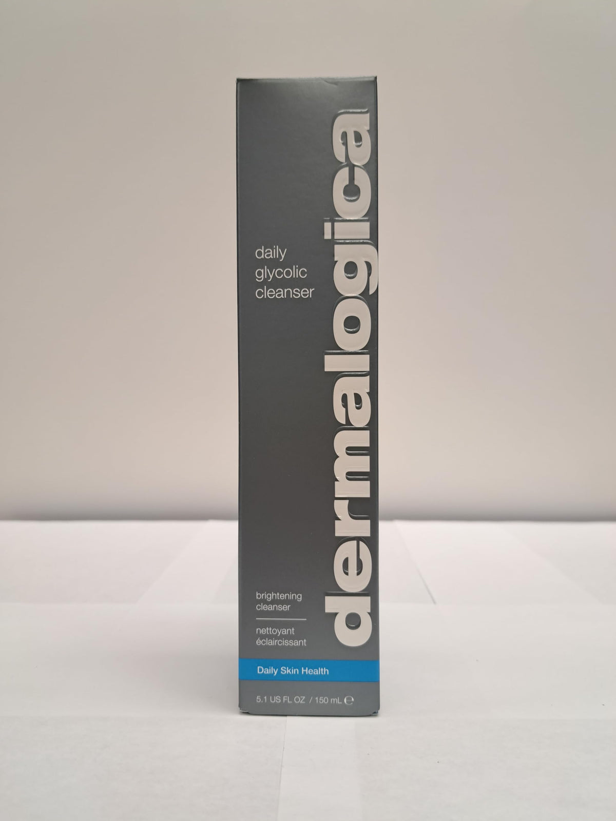 Dermalogica daily glycolic cleanser next to ruler showing 5.1 fl oz scale