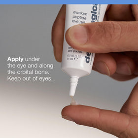 Applying Dermalogica eye gel under eye with ring finger to reduce puffiness effectively