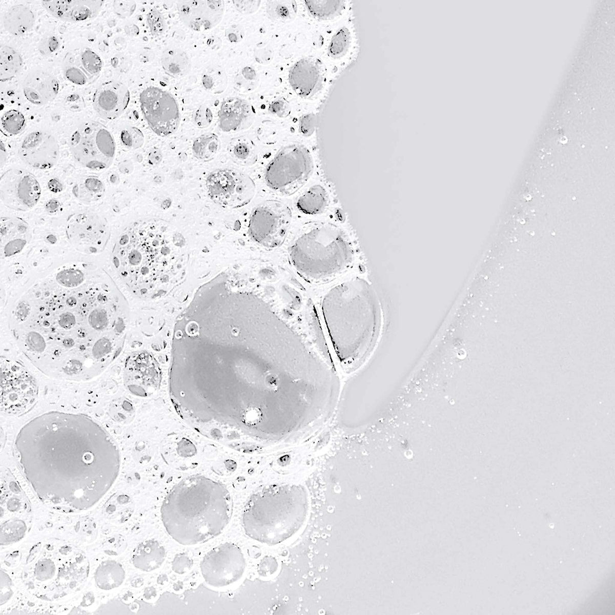 Dermalogica applied on hand in shower illustrating smooth cleansing