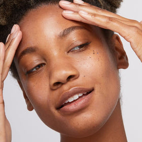 Dermalogica sunscreen tube against blue background emphasizing daily environmental defense