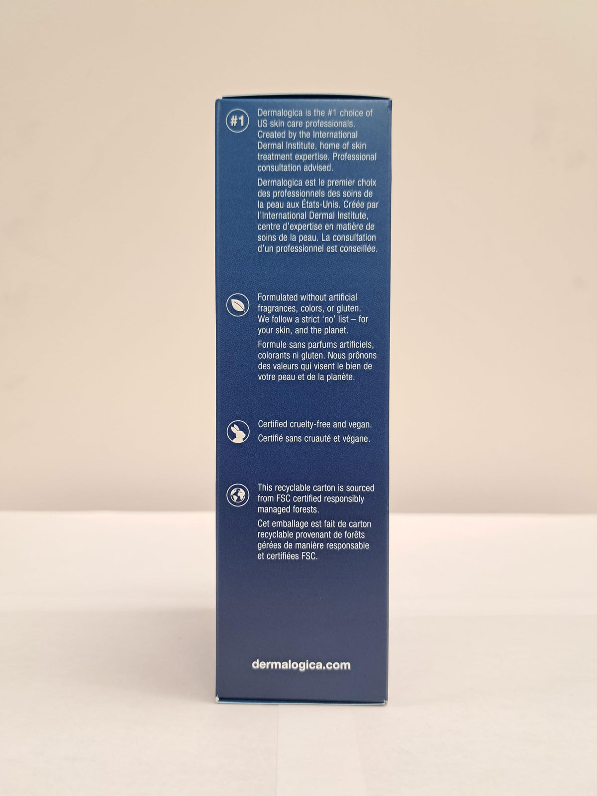 Dermalogica bottle alongside serum illustrating layering in routine