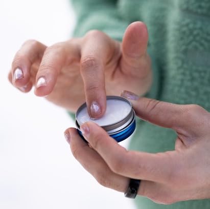 DERMATONE applying balm to lips for soothing wound and sun care