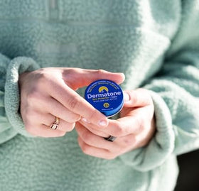 DERMATONE open tin showing smooth balm texture for easy application