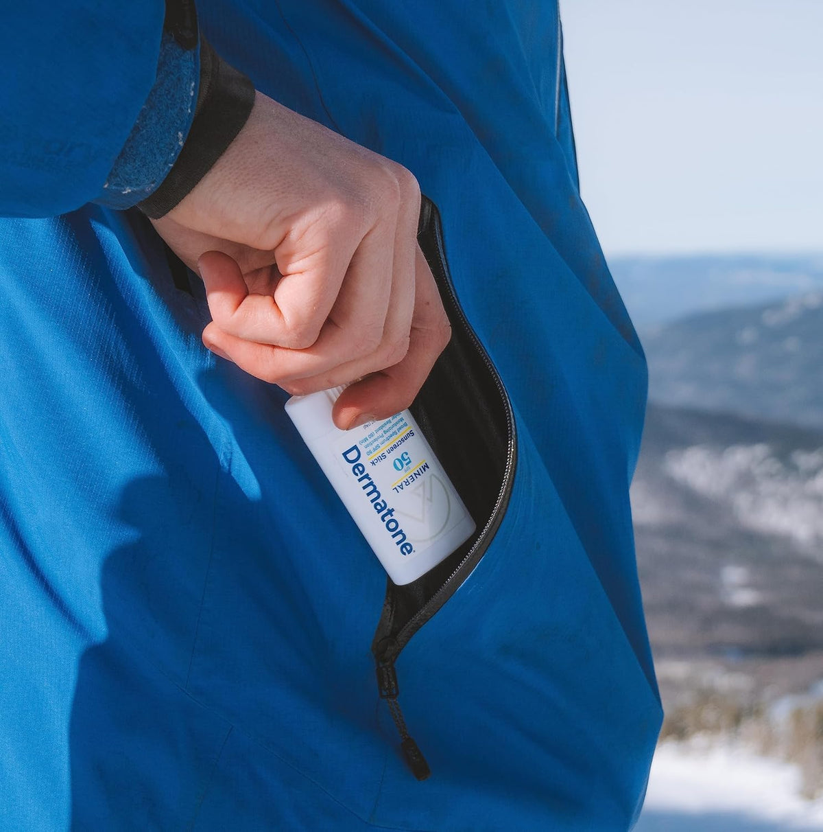 DERMATONE stick in hand showing compact travel-size convenience