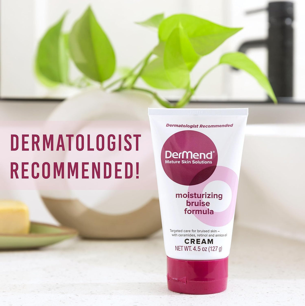 Dermend tube beside a hand for size comparison and travel-friendly benefit
